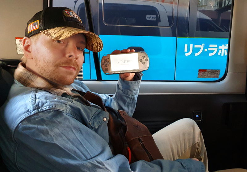 Holding a Silver PSP-3000 I got at the Tokyo Flea Market